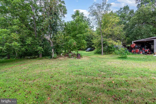 a backyard of a house with lots of green space
