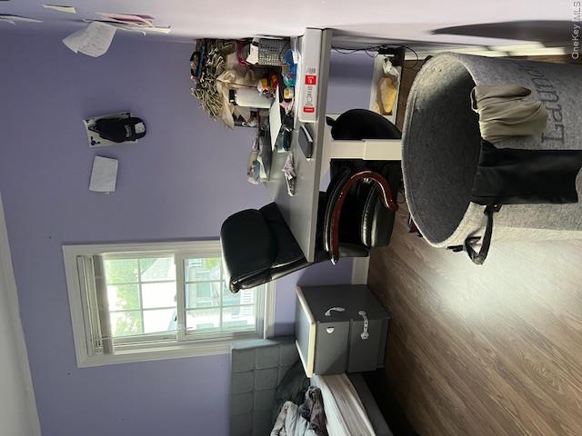 225 Thompson Shore Road, Unit 2F Manhasset, NY 11030 - Photo 4 of 15 a bedroom with a bed and a window