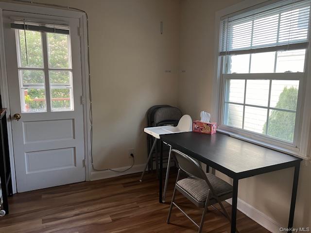 225 Thompson Shore Road, Unit 2F Manhasset, NY 11030 - Photo 6 of 15 a view of a dining room with furniture window and wooden floor