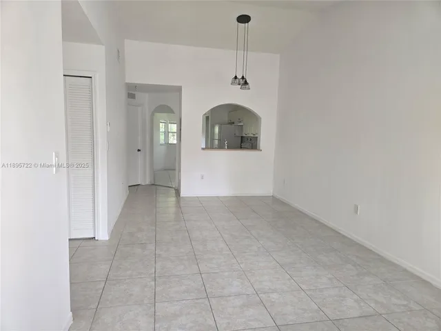a view of a hallway with a carpet