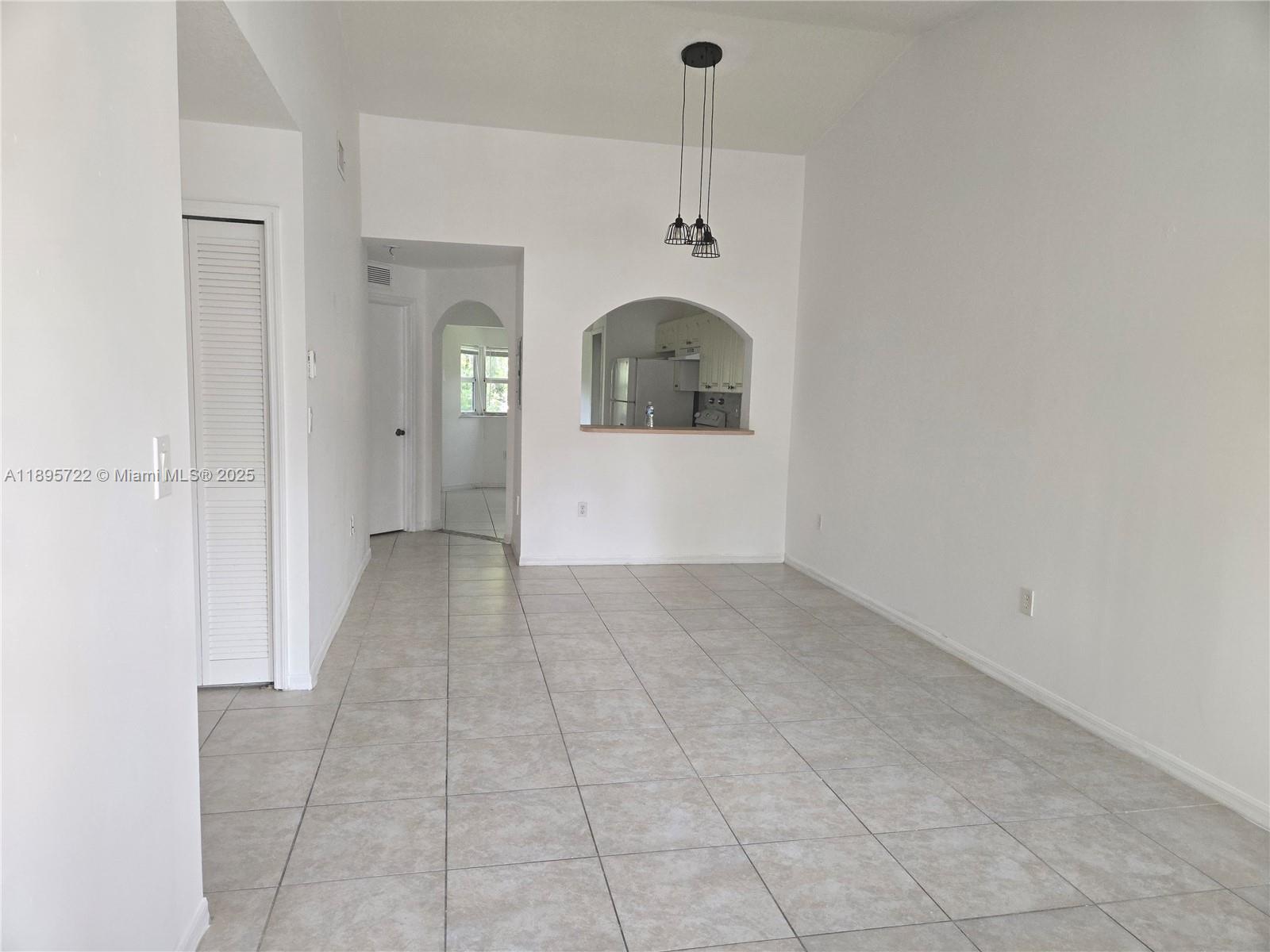 2920 Southeast 12th Road, Unit 20430 Homestead, FL 33035 - Photo 3 of 10 a view of a hallway with a carpet