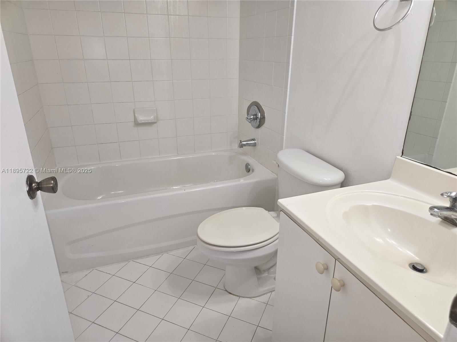 2920 Southeast 12th Road, Unit 20430 Homestead, FL 33035 - Photo 9 of 10 a bathroom with a sink toilet and shower