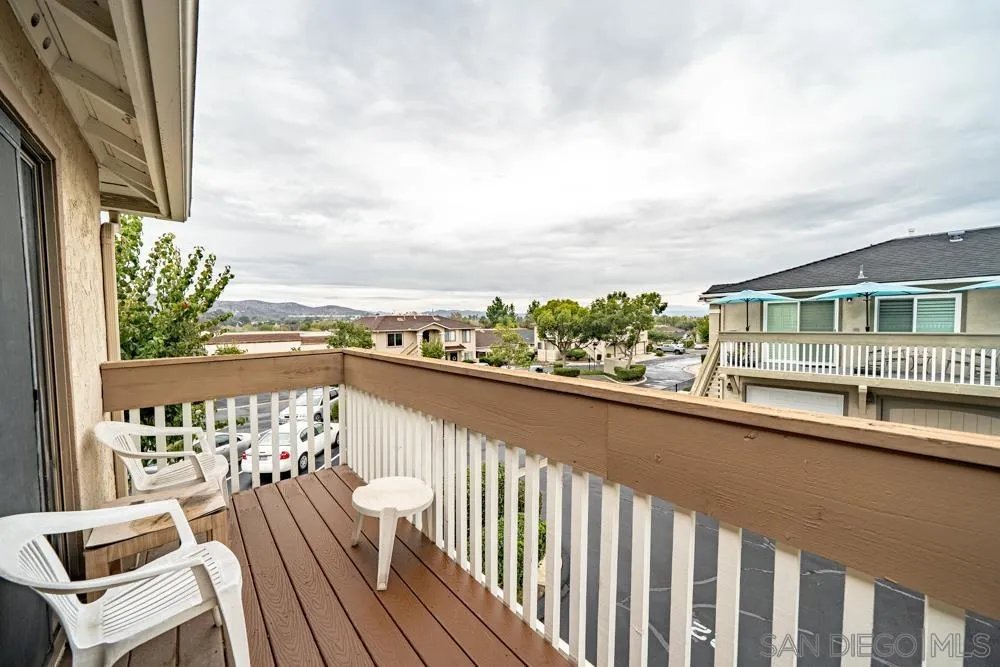 7967 Arly Court, Unit 24 Santee, CA 92071 - Photo 14 of 25 a view of a balcony with wooden chairs