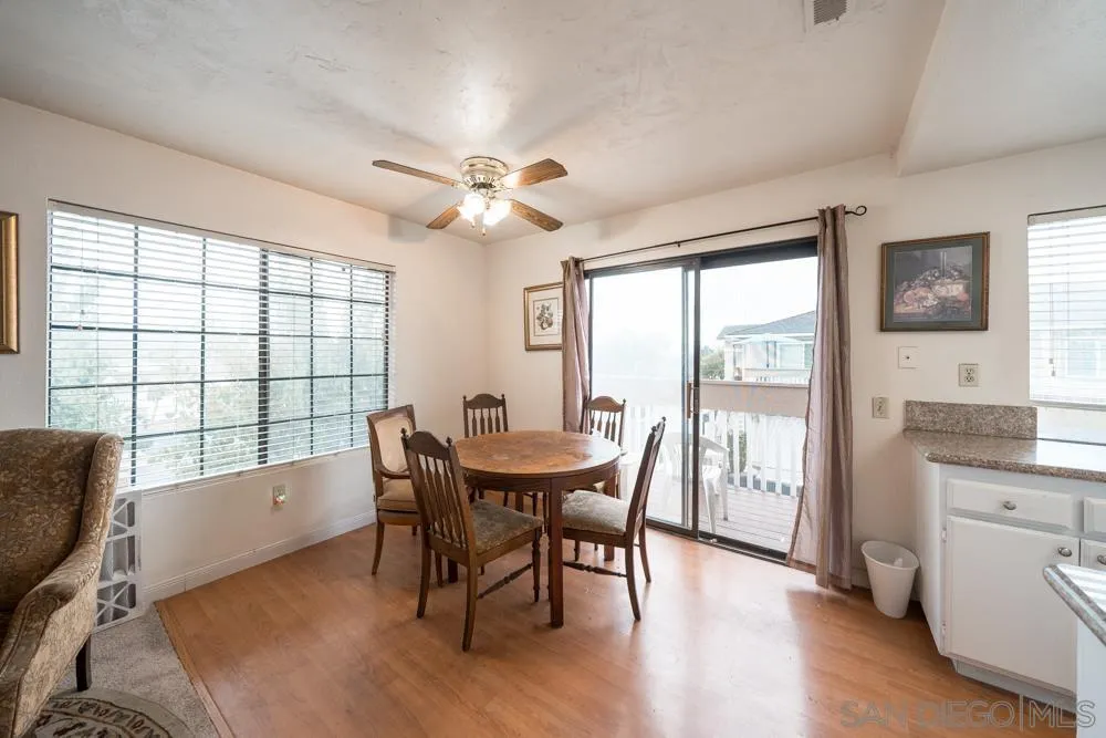7967 Arly Court, Unit 24 Santee, CA 92071 - Photo 15 of 25 a view of a dining room with furniture window and wooden floor
