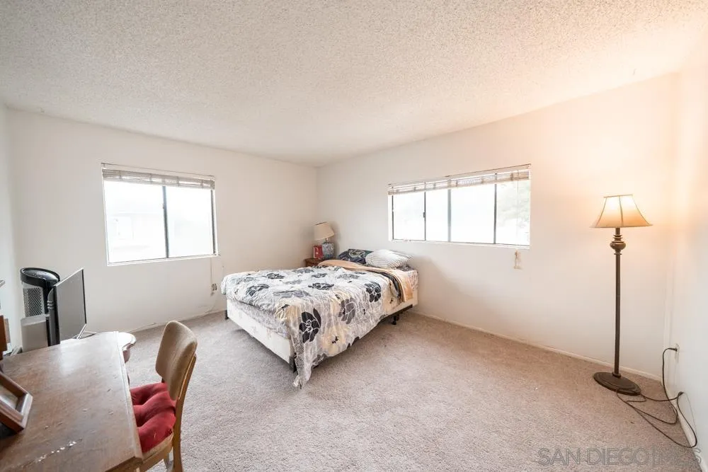 7967 Arly Court, Unit 24 Santee, CA 92071 - Photo 5 of 25 a bedroom with a bed and a window
