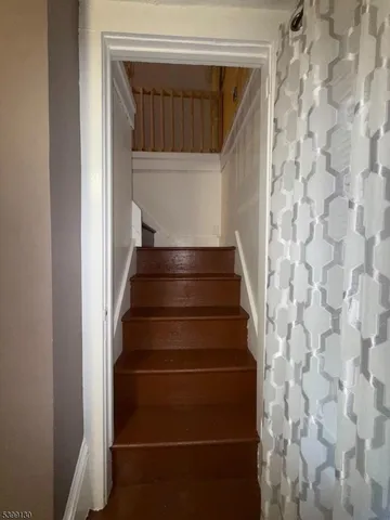 a living room with chairs and a table