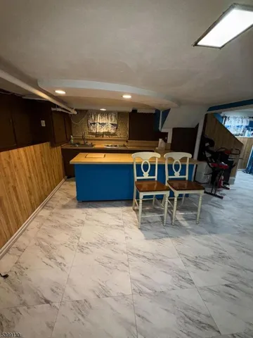 a bathroom with a sink a toilet and a shower