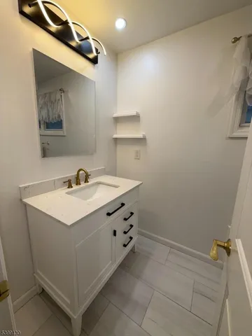 a bathroom with a sink and a mirror