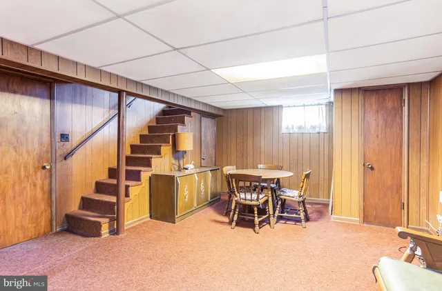a dining room with furniture and entryway