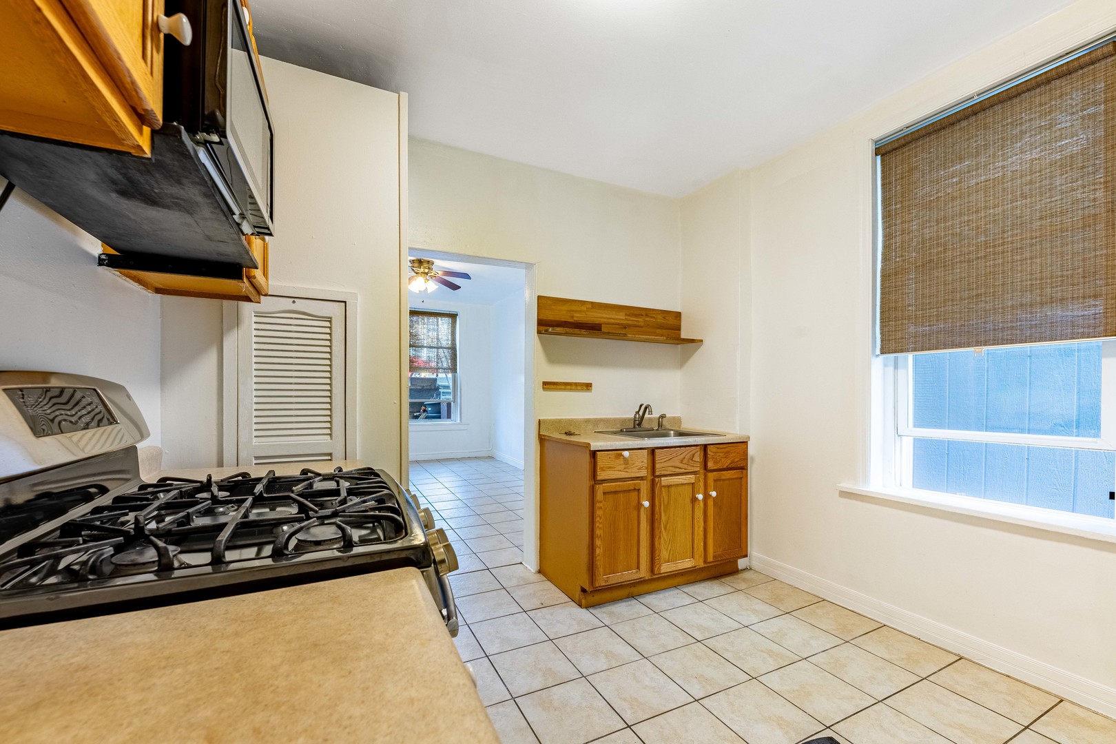 2109 West Cullerton Street Chicago, IL 60608 - Photo 13 of 14 a kitchen with stainless steel appliances stove top oven and cabinets