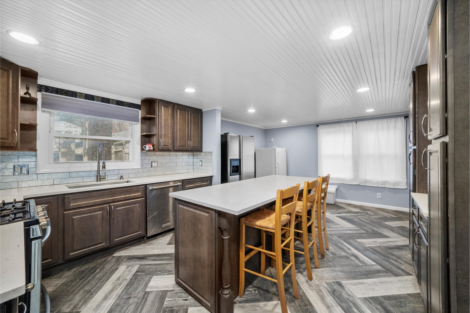 473 Rockhurst Road Bolingbrook, IL 60440 - Photo 2 of 26 a kitchen with stainless steel appliances granite countertop wooden cabinets a stove a sink and a refrigerator