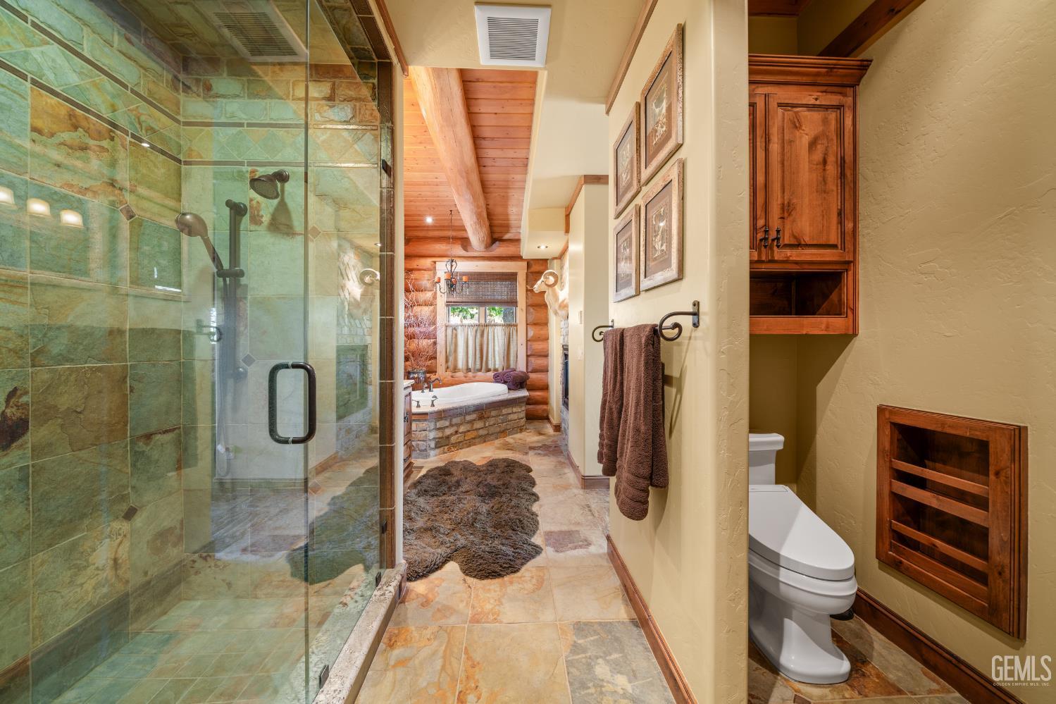 Undisclosed Address Tehachapi, CA 93561 - Photo 34 of 73 a bathroom with a granite countertop shower and a toilet