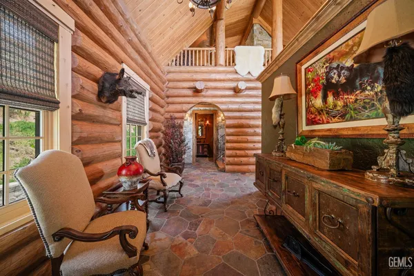 a front view of a house with outdoor seating