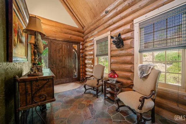 a kitchen with a table chairs and a stove