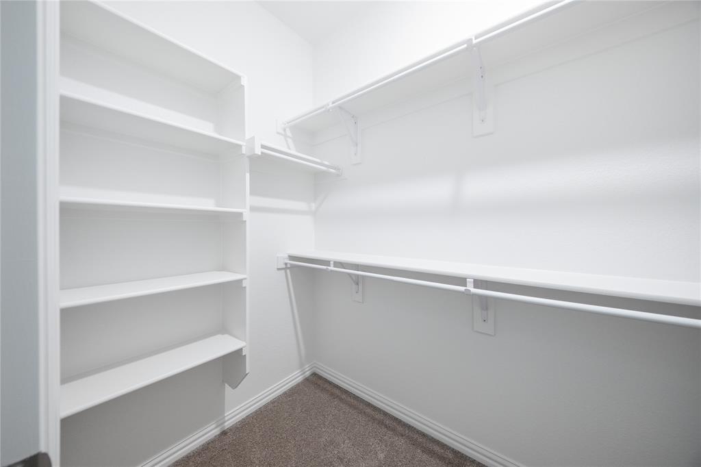 2015 Partridge Road Princeton, TX 75407 - Photo 14 of 27 a view of an empty walk in closet