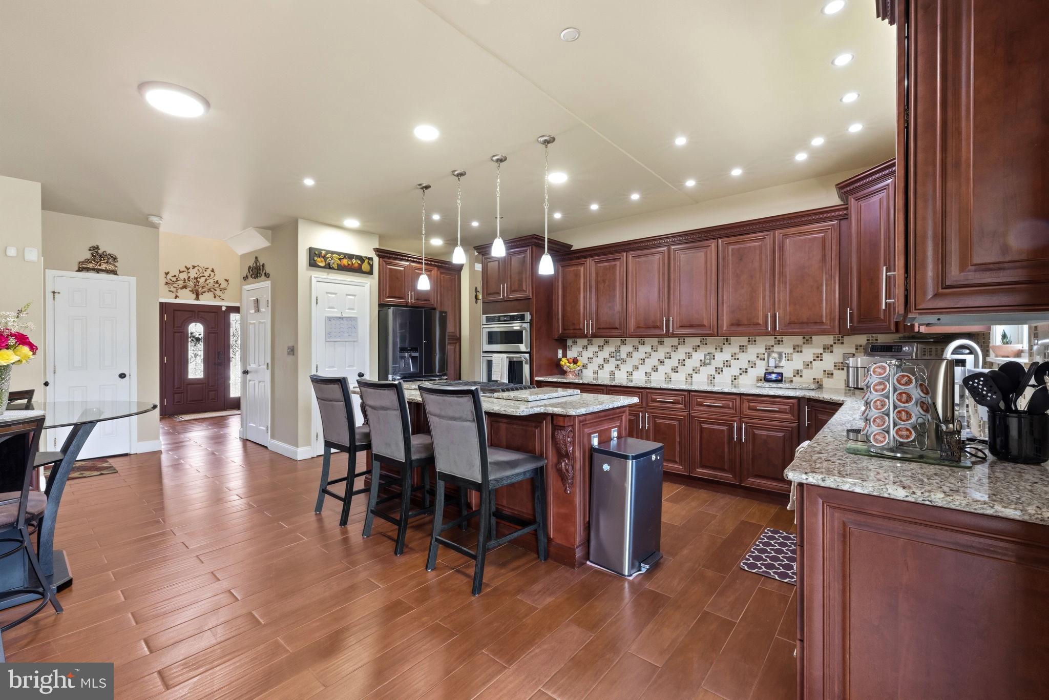 17 Paddock Road Marlton, NJ 08053 - Photo 13 of 54 Elegant kitchen with rich wood tones.