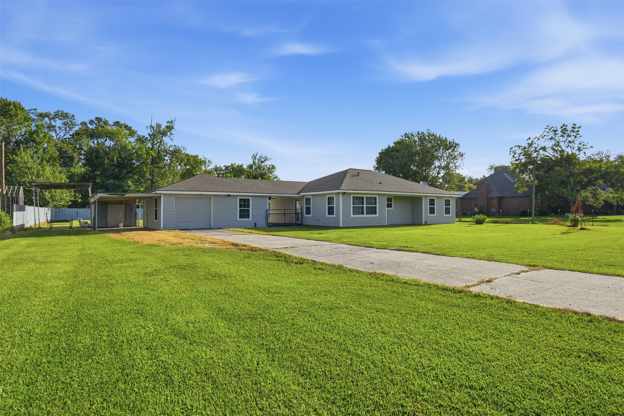 212 Jones Road Highlands, TX 77562 - Photo 2 of 24 a front view of a house with a yard