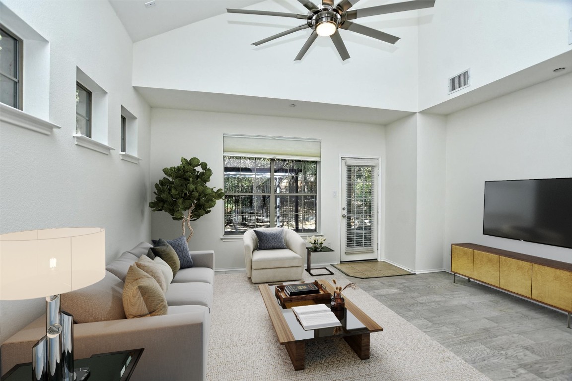 1310 West Parmer Lane, Unit 2803 Austin, TX 78727 - Photo 11 of 40 a living room with furniture and a flat screen tv