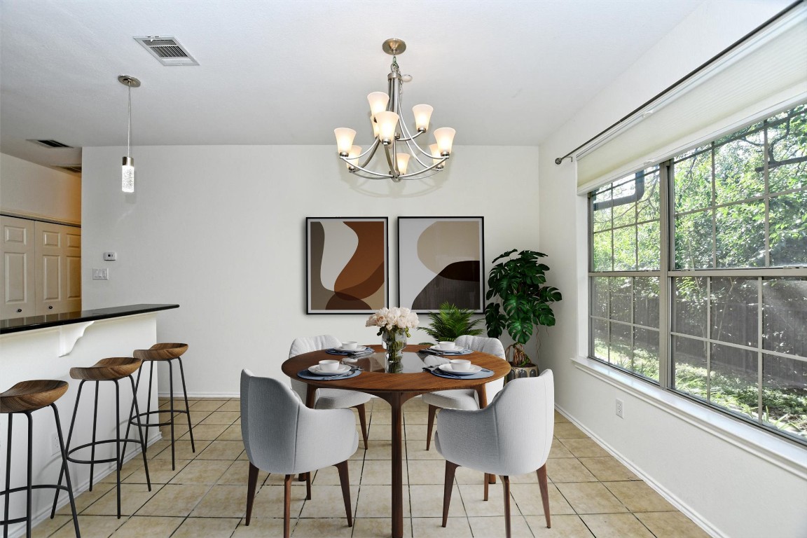 1310 West Parmer Lane, Unit 2803 Austin, TX 78727 - Photo 14 of 40 a view of a dining room with furniture window and outside view