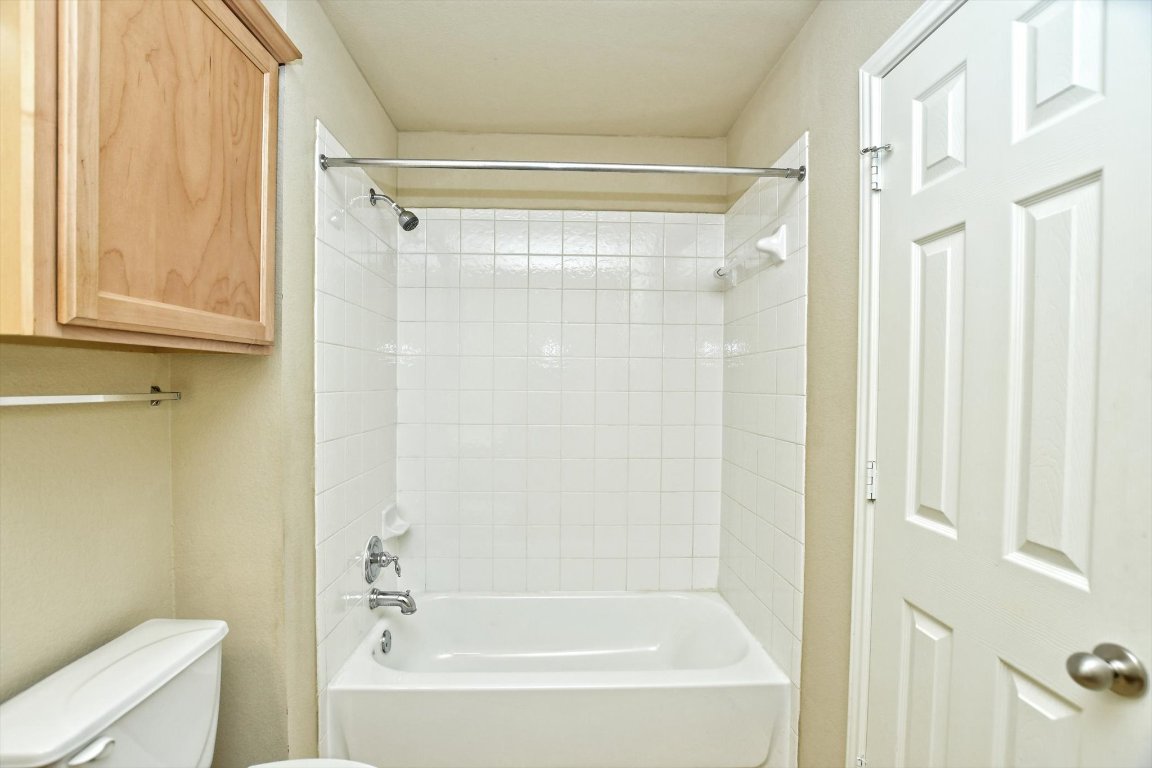 1310 West Parmer Lane, Unit 2803 Austin, TX 78727 - Photo 31 of 40 a bathroom with a shower and a bath tub