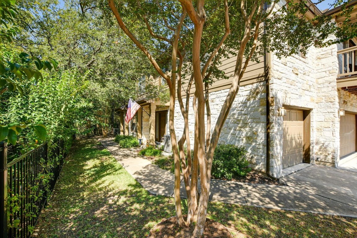 1310 West Parmer Lane, Unit 2803 Austin, TX 78727 - Photo 5 of 40 a backyard of a house with lots of green space