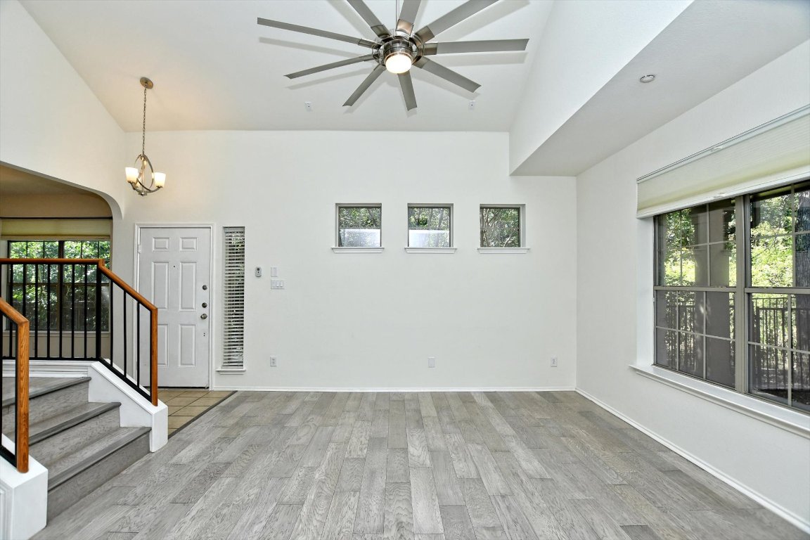 1310 West Parmer Lane, Unit 2803 Austin, TX 78727 - Photo 10 of 40 wooden floor in an empty room with a window