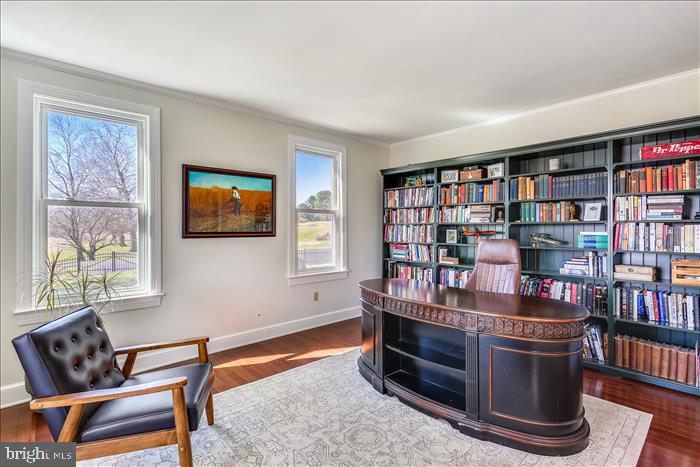 9333 Watkins Road Gaithersburg, MD 20882 - Photo 24 of 65 a living room with furniture a book shelf and a window