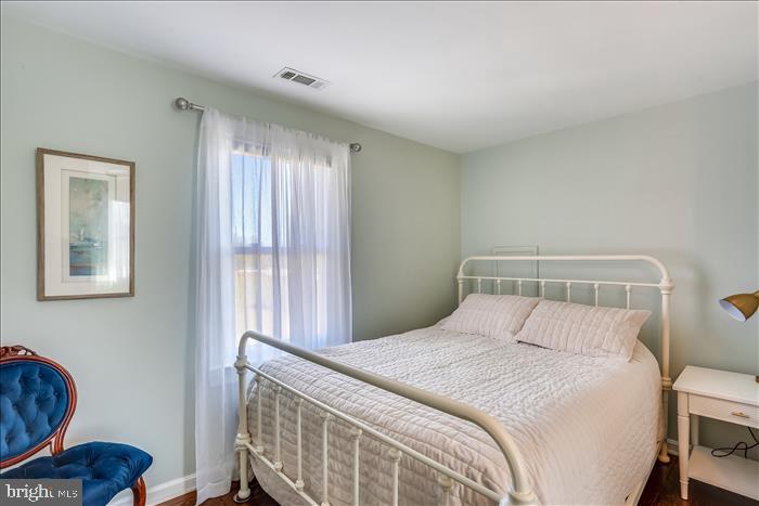 9333 Watkins Road Gaithersburg, MD 20882 - Photo 38 of 65 a bedroom with a bed and a window