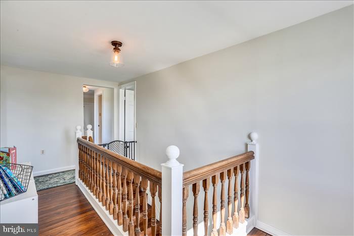 9333 Watkins Road Gaithersburg, MD 20882 - Photo 40 of 65 a view of staircase with railing and white walls