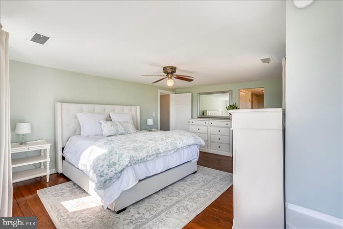 9333 Watkins Road Gaithersburg, MD 20882 - Photo 41 of 65 a bedroom with a bed and a refrigerator