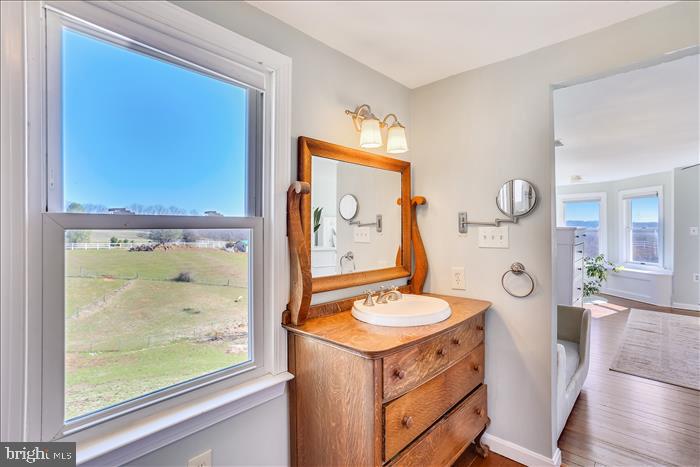 9333 Watkins Road Gaithersburg, MD 20882 - Photo 47 of 65 a bathroom with a granite countertop sink mirror and vanity