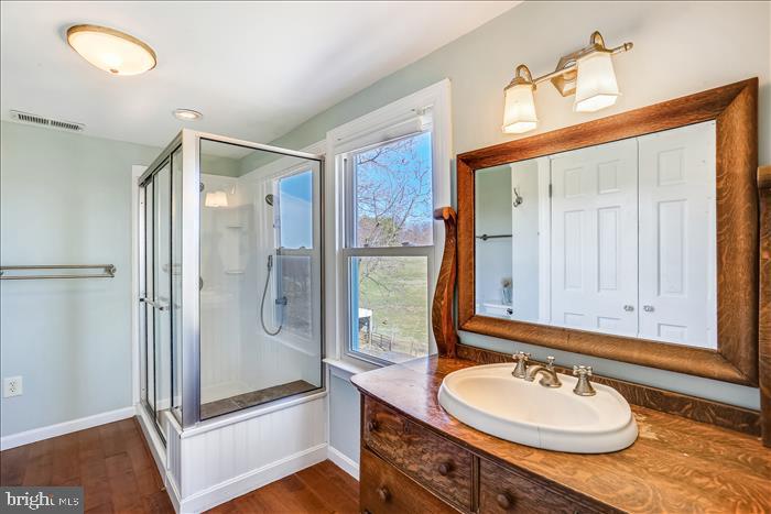 9333 Watkins Road Gaithersburg, MD 20882 - Photo 49 of 65 a bathroom with a sink double vanity granite tub shower and a mirror