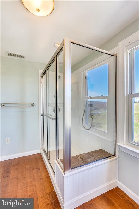 9333 Watkins Road Gaithersburg, MD 20882 - Photo 50 of 65 a bathroom with a glass shower door and a sink