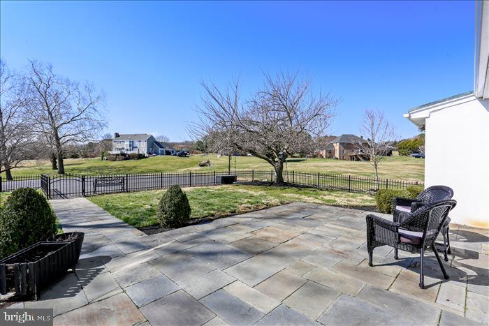 9333 Watkins Road Gaithersburg, MD 20882 - Photo 53 of 65 a view of a patio with table and chairs and potted plants