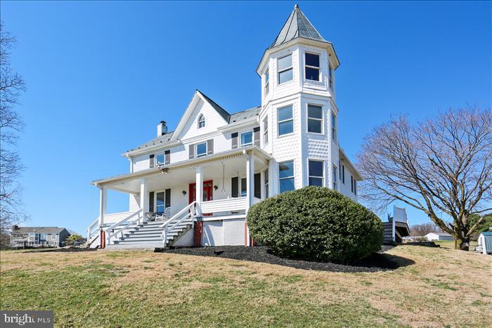 9333 Watkins Road Gaithersburg, MD 20882 - Photo 64 of 65 a front view of a house with a yard