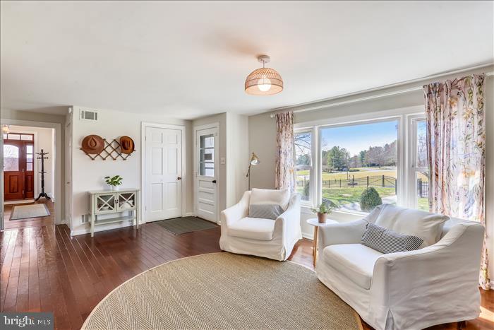 9333 Watkins Road Gaithersburg, MD 20882 - Photo 8 of 65 a living room with furniture and a large window