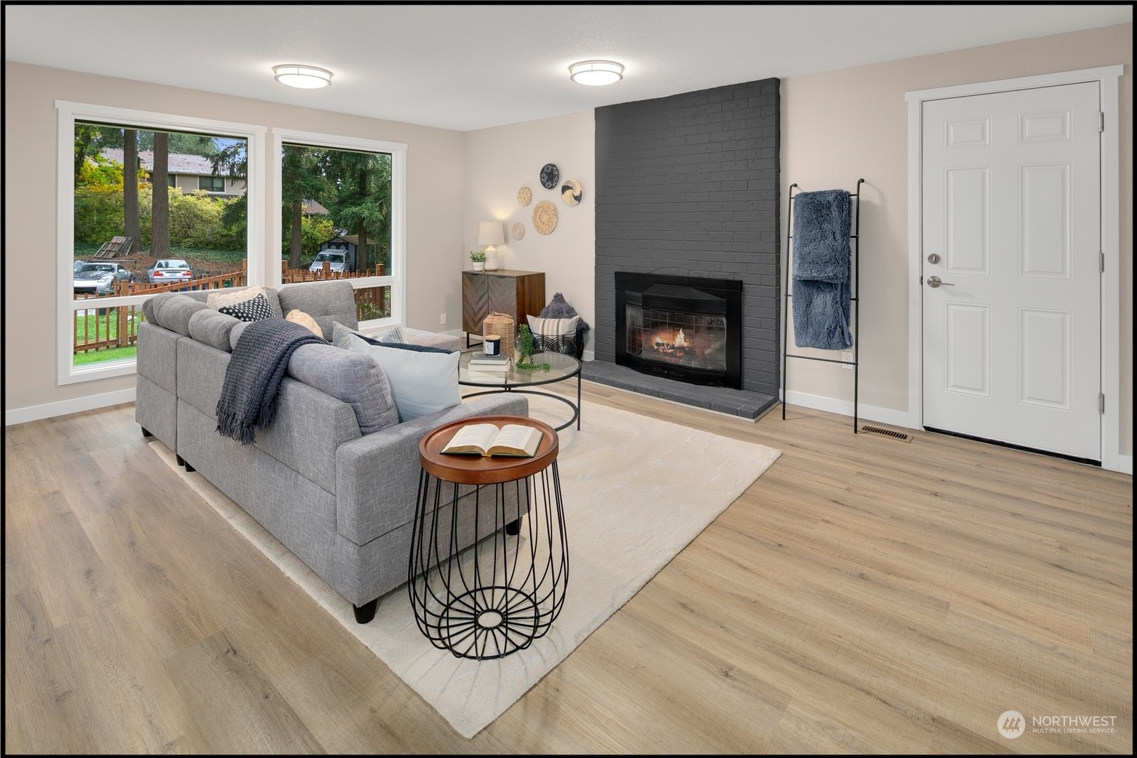 17114 North Road Bothell, WA 98012 - Photo 6 of 30 a living room with furniture and a fireplace