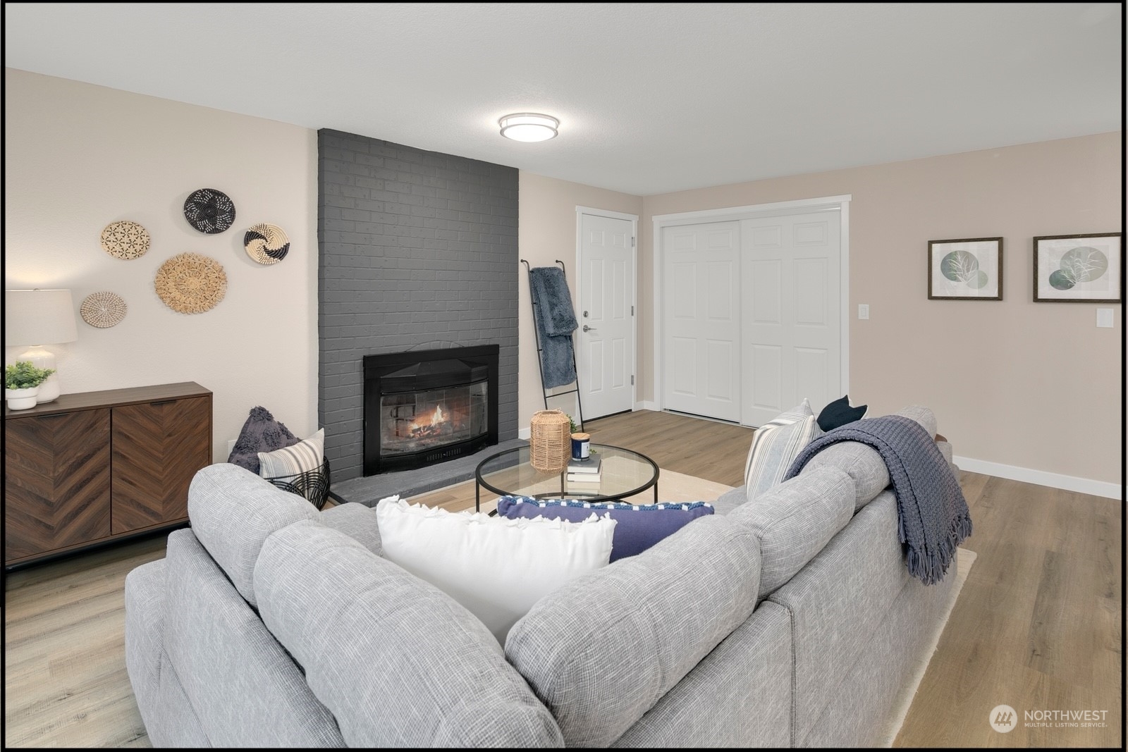 17114 North Road Bothell, WA 98012 - Photo 7 of 30 a living room with furniture and a fireplace