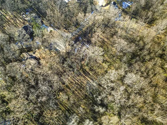 a view of a park with iron fence