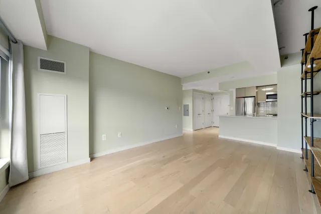 a view of an empty room with a window