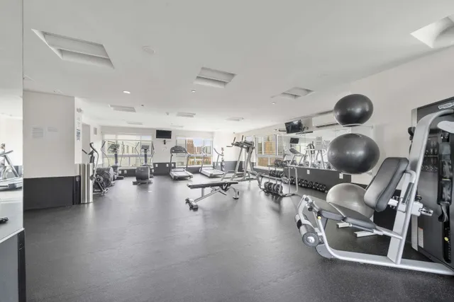 a bathroom with a sink toilet vanity and tub
