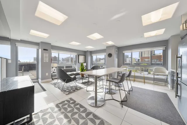 a living room with lots of furniture and a table