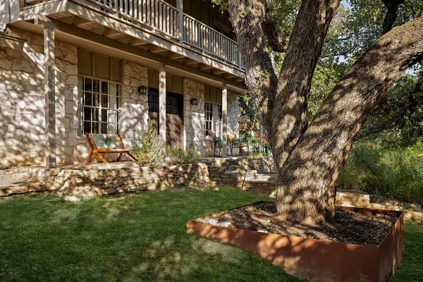 front view of a house with a tree