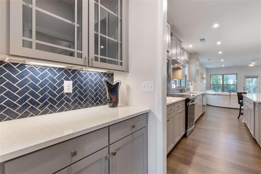5213 Morrell Road Hoschton, GA 30548 - Photo 17 of 49 a kitchen with a sink and a refrigerator