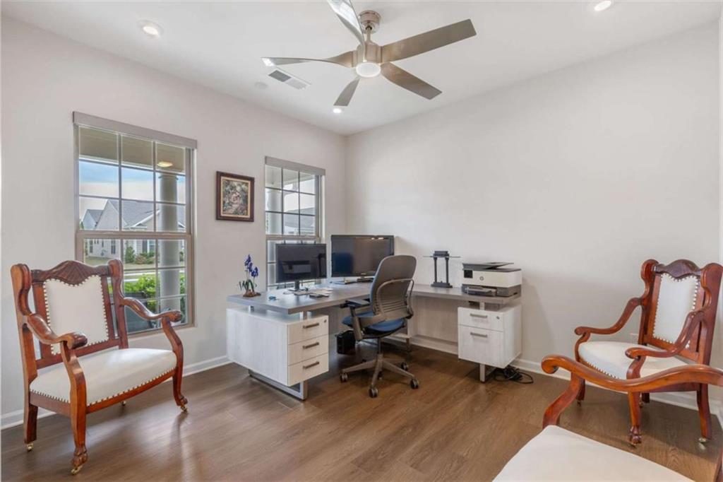 5213 Morrell Road Hoschton, GA 30548 - Photo 10 of 49 a work room with furniture and windows