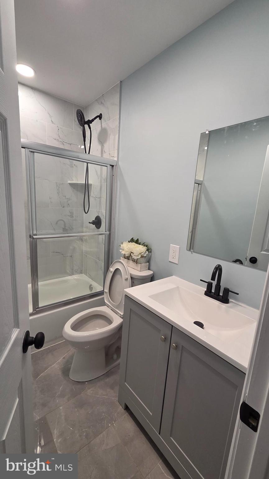 6519 Cutler Street Philadelphia, PA 19126 - Photo 12 of 24 a bathroom with a sink toilet and shower