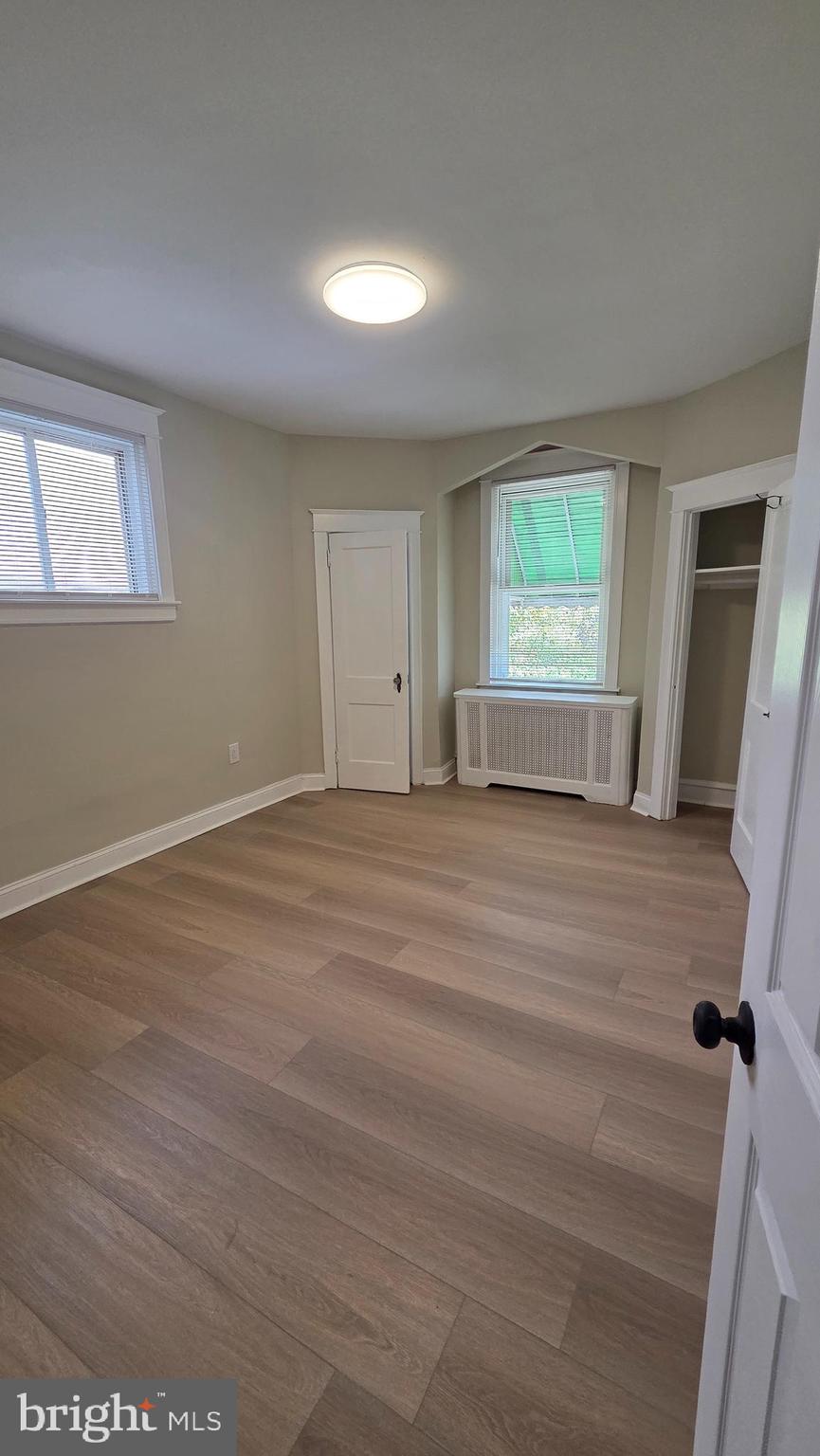 6519 Cutler Street Philadelphia, PA 19126 - Photo 19 of 24 a view of empty room with wooden floor and fan