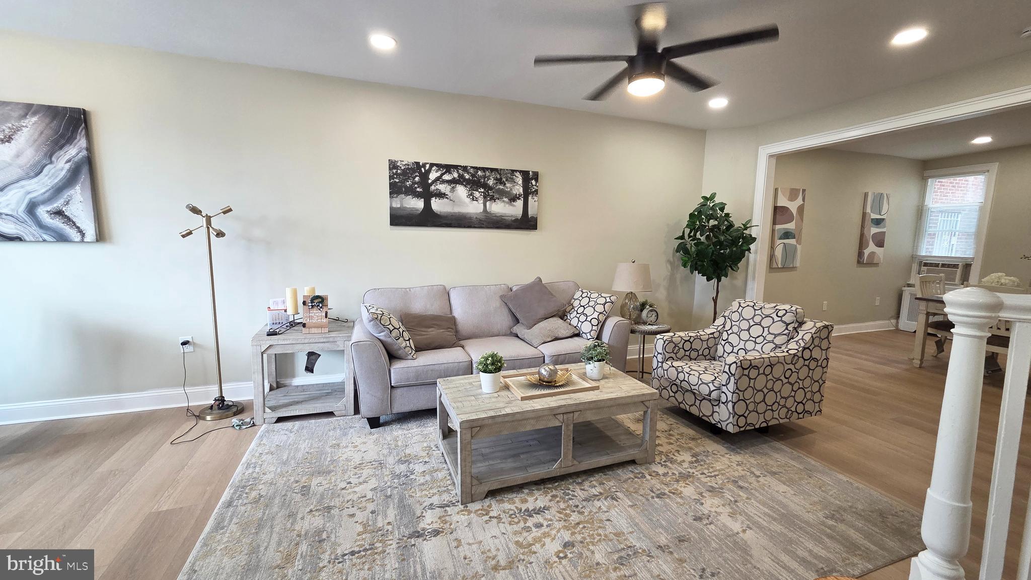 6519 Cutler Street Philadelphia, PA 19126 - Photo 2 of 24 a living room with furniture and a chandelier