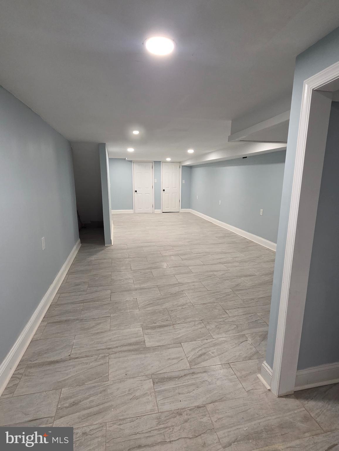 6519 Cutler Street Philadelphia, PA 19126 - Photo 21 of 24 a view of an empty room with wooden floor and a window