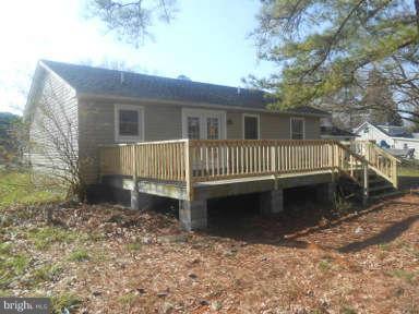 7384 Station Road Newcomb, MD 21653 - Photo 3 of 10 a view of a house with a yard